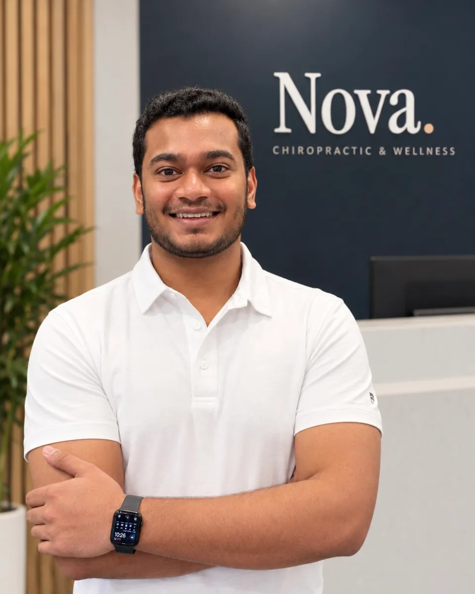 Prit Shah, Office Manager, at the front desk of Nova Chiropractic & Wellness